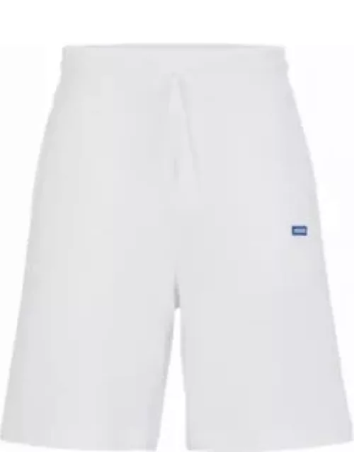 Cotton-terry shorts with blue logo patch- White Men's Jogging Pant