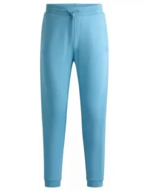 Cotton-terry tracksuit bottoms with logo patch- Light Blue Men's Jogging Pant