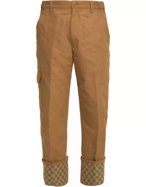 Beige trousers with GG cuff