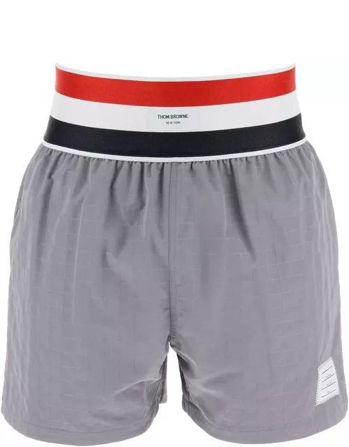 THOM BROWNE nylon bermuda shorts with elastic band in red