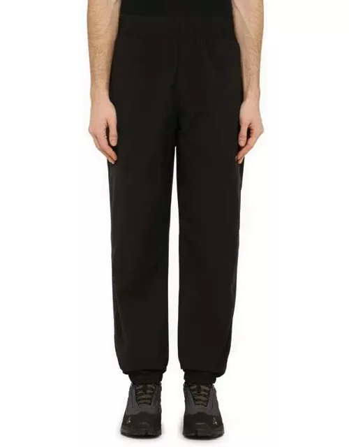 Black trousers in technical fabric with logo