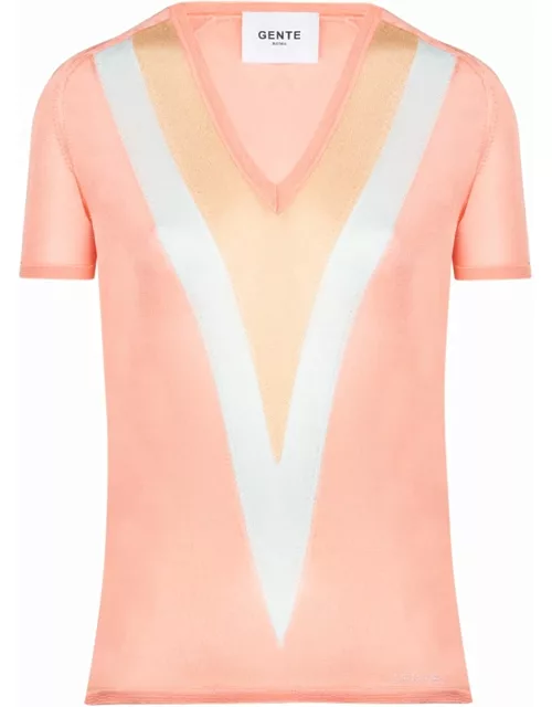 Pink sweater with geometric V-neck