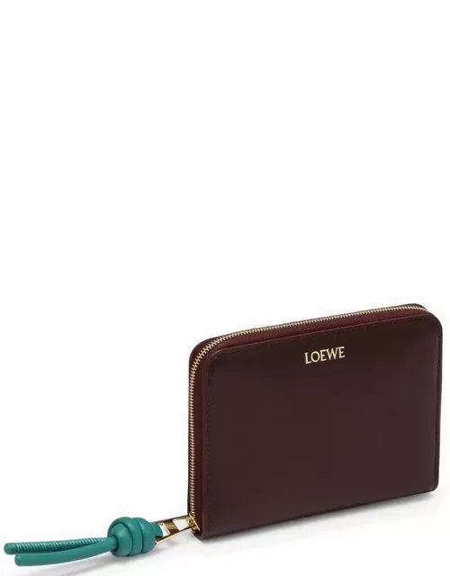 Knot compact zipped wallet in burgundy leather