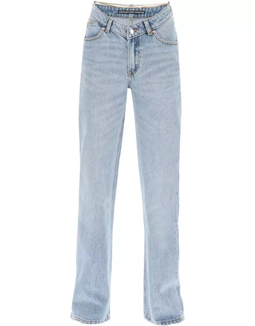 ALEXANDER WANG asymmetric waist jeans with chain detail.