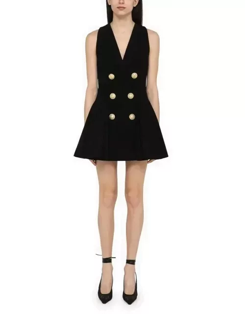 Black mini dress with gold button