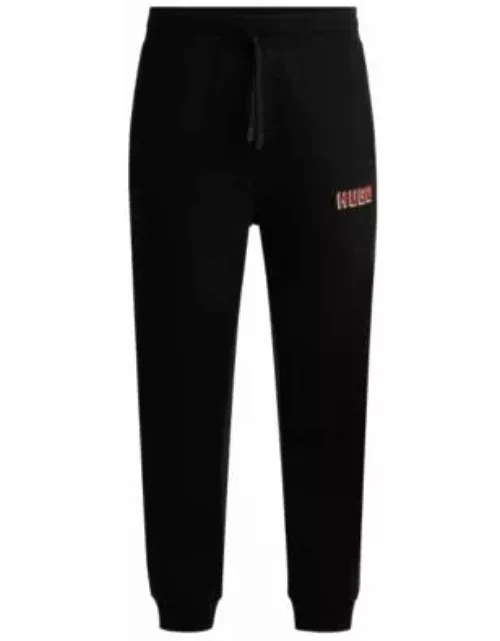 Cotton-terry tracksuit bottoms with logo print- Black Men's Jogging Pant