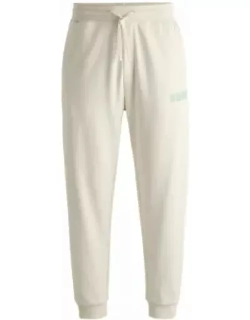 Cotton-terry tracksuit bottoms with logo print- White Men's Jogging Pant