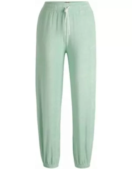 Cuffed tracksuit bottoms in terry fabric with handwritten logo- Light Green Women's All Clothing