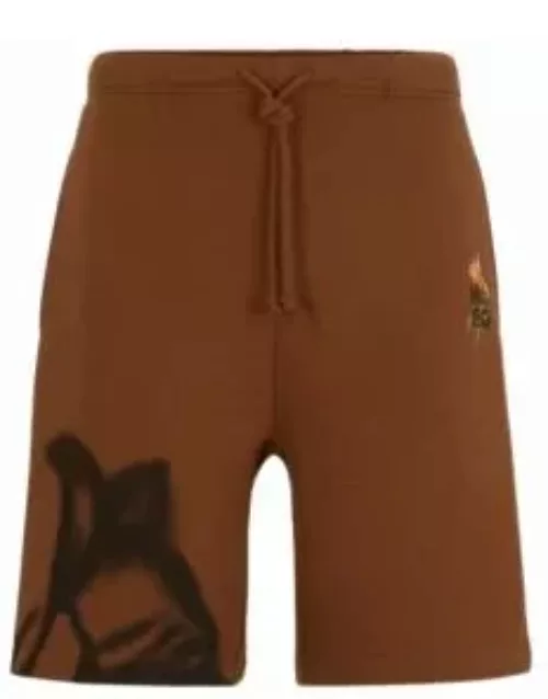 Relaxed-fit shorts with floral artwork- Brown Men's Clothing