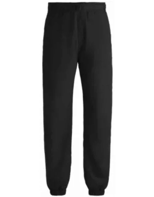 Water-repellent trousers with adjustable belt- Black Men's Casual Pant