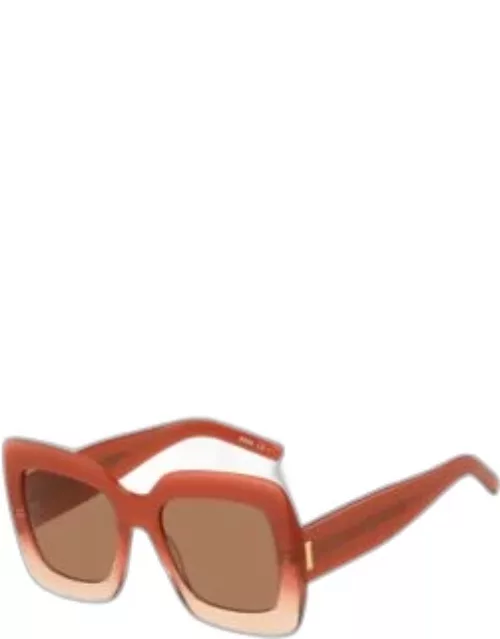Red-acetate round sunglasses with silver-tone chain Women's Eyewear