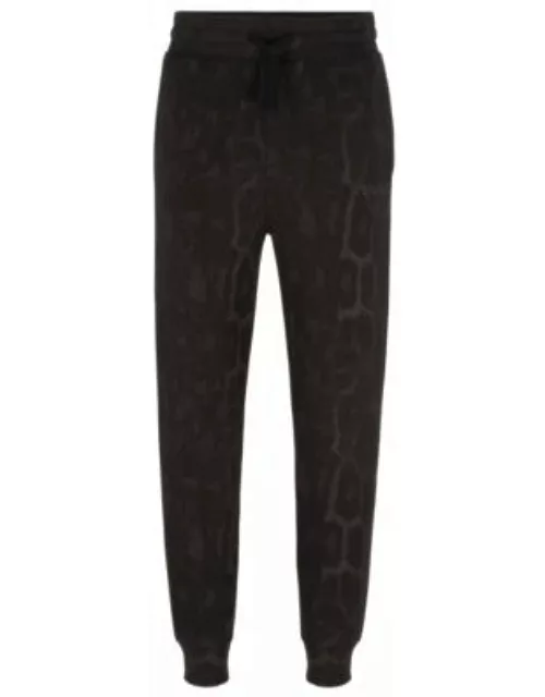 Jaglion-pattern tracksuit bottoms in French-terry cotton- Black Men's Jogging Pant