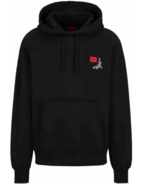 Cotton-terry hoodie with logo label and seasonal artwork- Black Men's Tracksuit