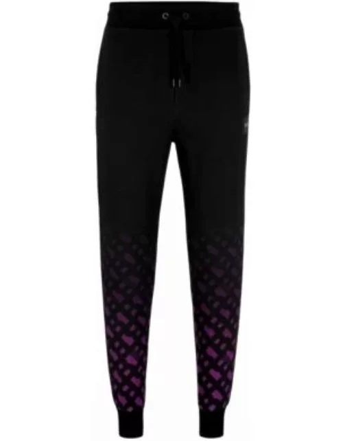 BOSS x Khaby Relaxed-fit cotton-blend tracksuit bottoms with gradient monograms- Dark Purple Men's Jogging Pant