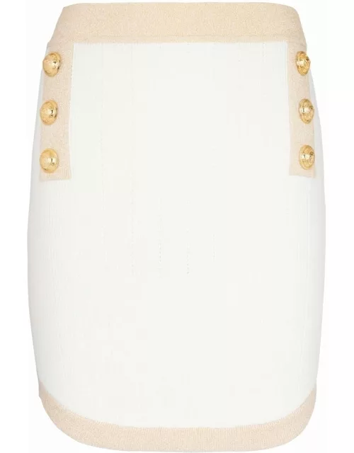 White pencil skirt with buttons and gold tri