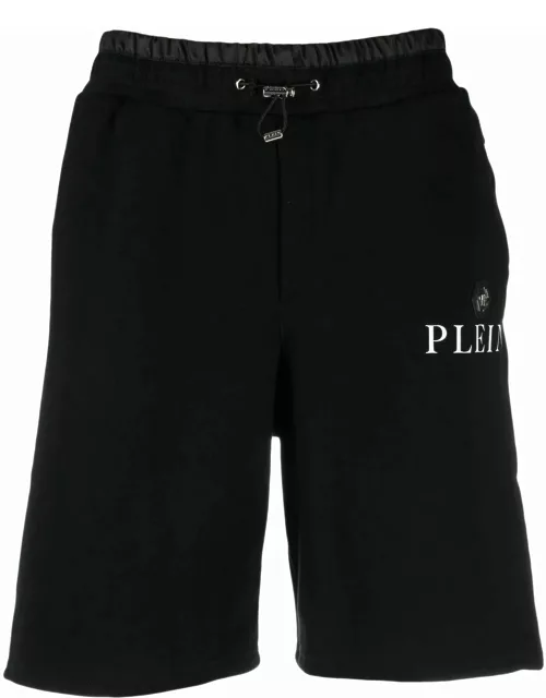 Black sports shorts with logo plaque
