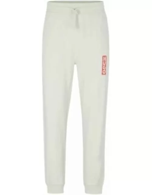 Cotton-terry tracksuit bottoms with vertical logo- Light Green Men's Jogging Pant