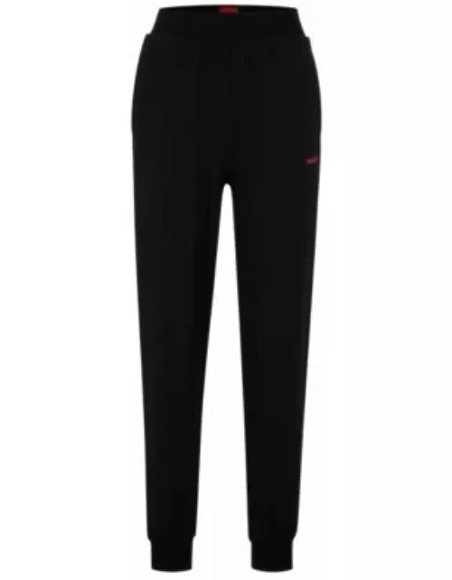 Relaxed-fit tracksuit bottoms with printed logo- Black Women's All Clothing