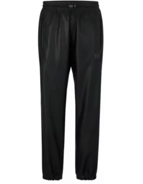 Faux-leather tracksuit bottoms with framed logo- Black Men's Casual Pant