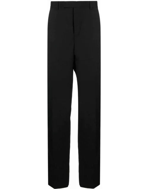 Black tailored trousers with Medusa plaque detai