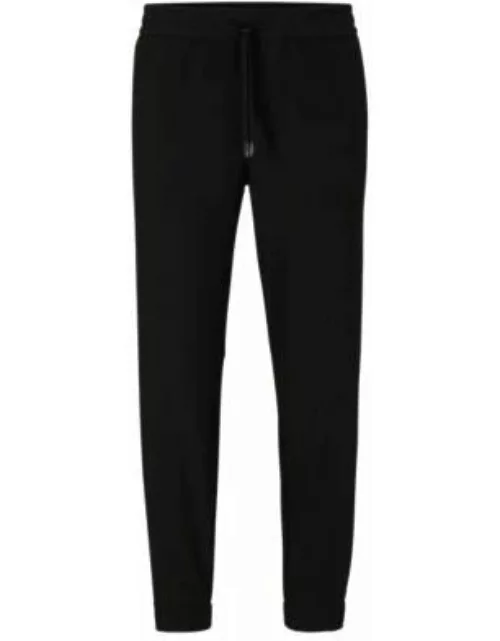 Tapered-fit chinos in easy-iron four-way stretch fabric- Black Men's Casual Pant