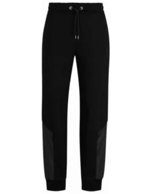 Porsche x BOSS cotton-blend tracksuit bottoms with embroidered logo- Black Men's Jogging Pant