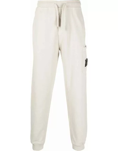 Beige sport pants with Compass patch