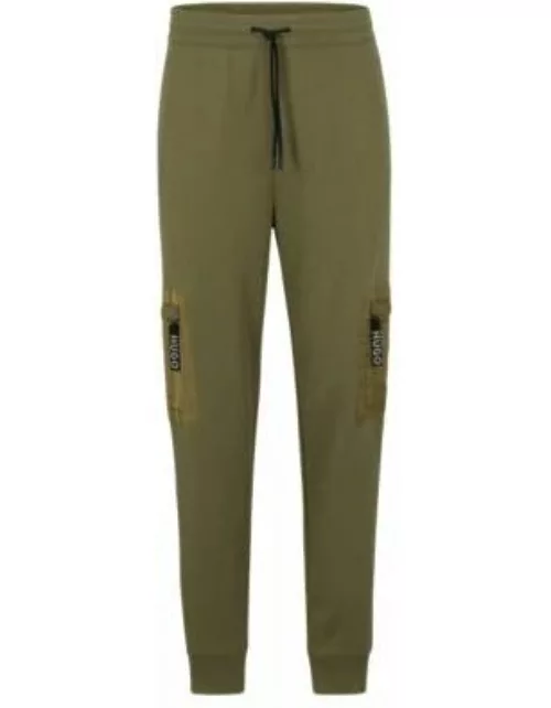 Relaxed-fit tracksuit bottoms with cargo pockets- Light Green Men's Jogging Pant