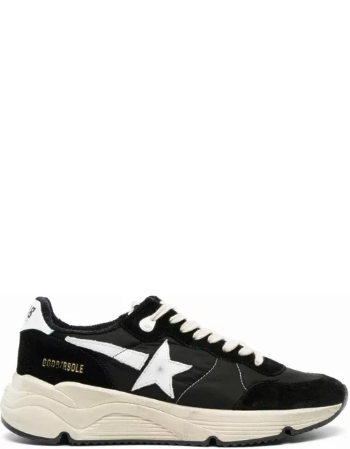 Black trainers with star appliqué