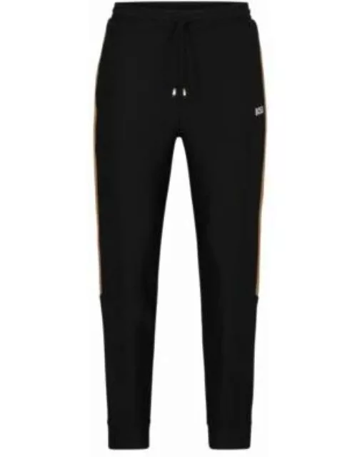 BOSS x Matteo Berrettini tracksuit bottoms with stripes and logo- Black Men's Jogging Pant