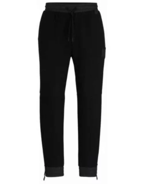 Stretch-cotton tracksuit bottoms with logo patch- Black Men's Jogging Pant