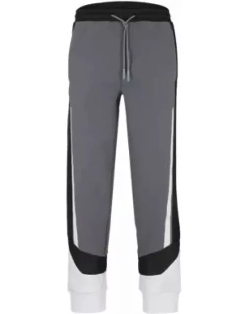 Mixed-material tracksuit bottoms with printed logo- Grey Men's Jogging Pant