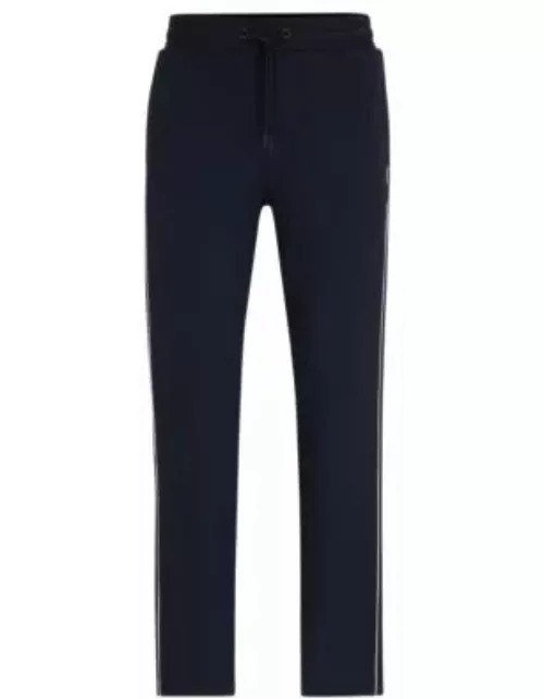 Regular-fit tracksuit bottoms with contrast piping- Dark Blue Men's Jogging Pant