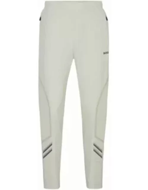 Regular-fit tracksuit bottoms with decorative reflective artwork- Light Beige Men's Jogging Pant