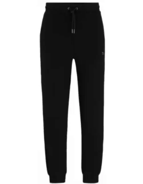 Stretch-cotton tracksuit bottoms with stacked logo- Black Men's Jogging Pant