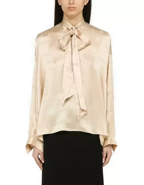 Champagne-coloured silk shirt with bow