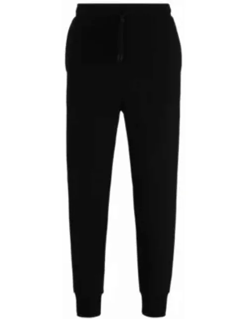 Stretch-cotton tracksuit bottoms with logo print- Black Men's Jogging Pant
