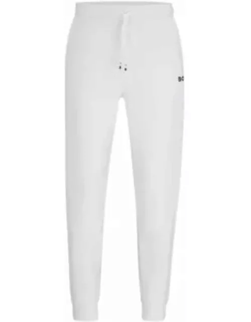 BOSS x Matteo Berrettini tracksuit bottoms with contrast tape and branding- White Men's Jogging Pant