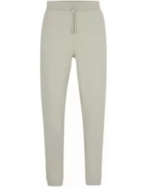 Cotton-terry tracksuit bottoms with logo patch- Light Beige Men's Jogging Pant